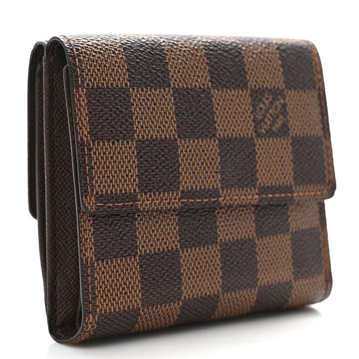 This is an authentic LOUIS VUITTON Damier Ebene Elise Wallet. This stylish wallet is crafted of Louis Vuitton signature damier check canvas. The wallet opens with a flap and a snap to a currency compartment and a flap on the reverse to a brown cross-grain leather interior of card slots, patch pockets and a billfold. Louis Vuitton Damier Ebene, Damier Ebene, Leather Interior, Authentic Louis Vuitton, Louis Vuitton Damier, Card Slots, Slots, Grain, Louis Vuitton