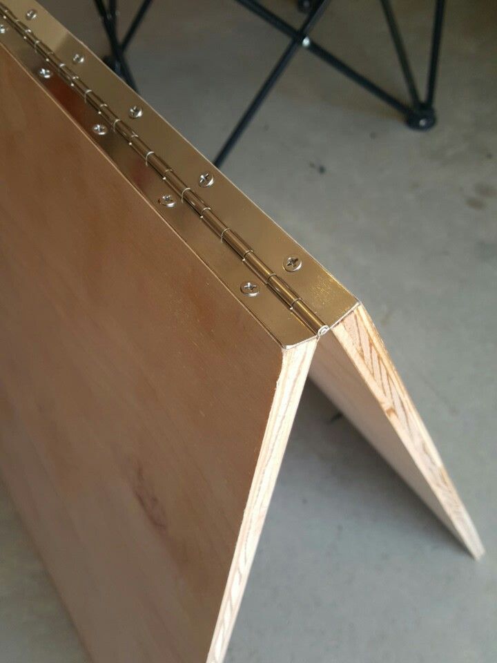 a close up of a wooden door with metal rivets on it's sides