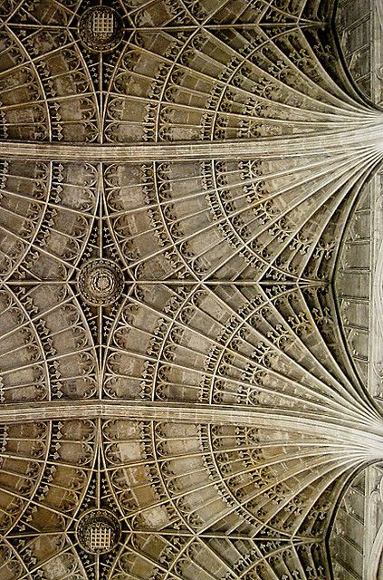 an intricate ceiling in the middle of a building