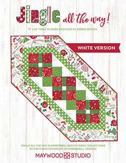 the quilter's companion white version is shown in red and green, with christmas themed designs on it