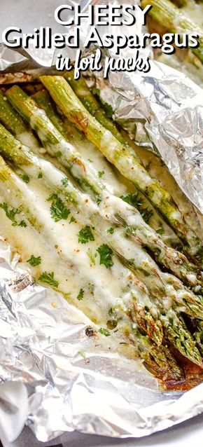 grilled asparagus in foil wrap with cheese and parmesan on top