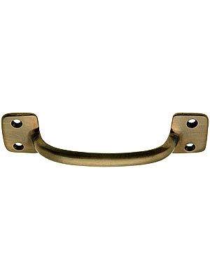 an old brass door handle on a white background