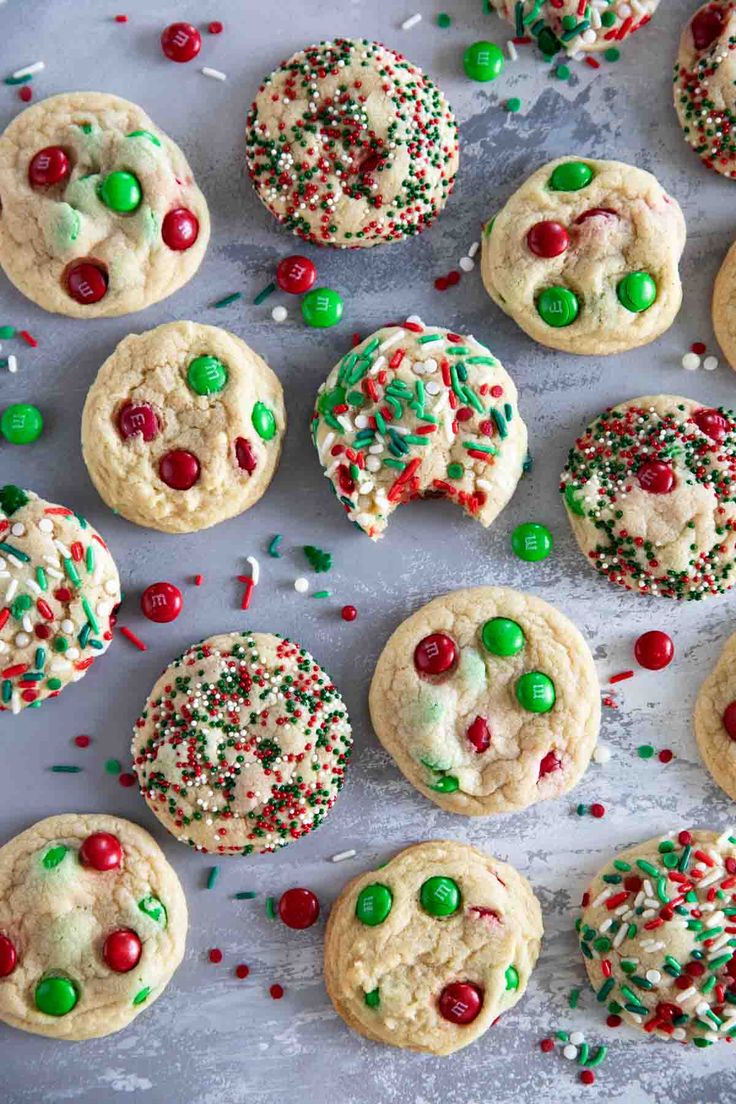 cookies with sprinkles and candies on a baking sheet, ready to be eaten