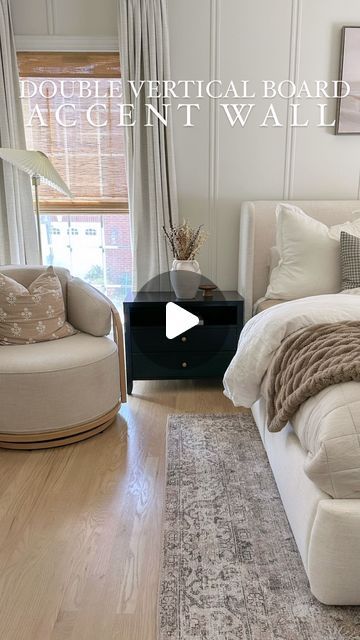 a bed room with a neatly made bed and two chairs