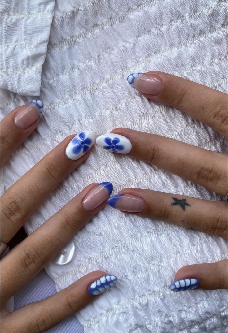 Easy Nail Designs Neutral, Navy Nails Design Winter, Mis Match Nail Designs, Super Cute Christmas Nails, Simple Design Almond Nails, Navy Blue And Pink Nails Acrylic, White Blue Flower Nails, Santorini Nail Ideas, Trending Nail Inspo 2024