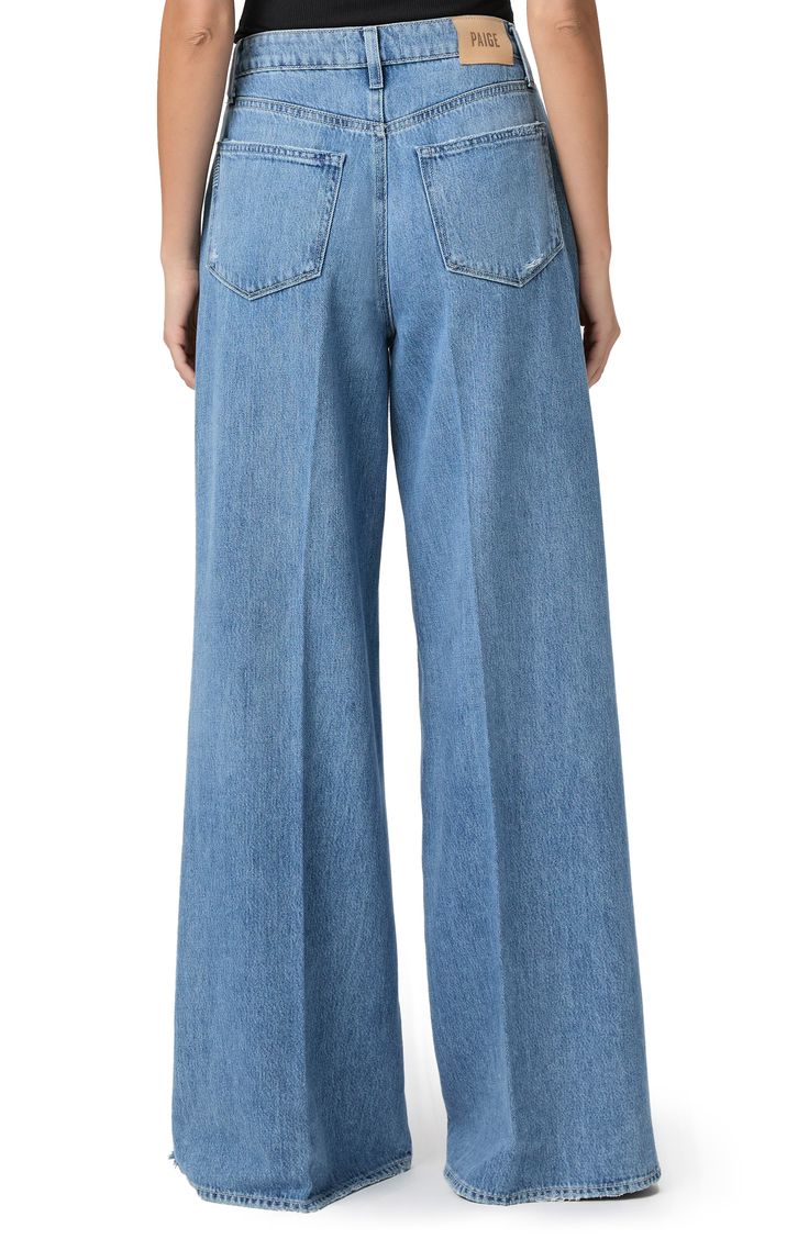 Made from supersoft and drapey denim, these vintage-inspired jeans feature the brand's highest waist and widest, longest legs to create a dramatic silhouette. 34 1/2" inseam; 28 1/2" leg opening; 12" front rise Zip fly with button closure Five-pocket style 60% cotton, 40% lyocell Machine wash, tumble dry Imported Medium Wash Wide Leg Flare Jeans With Belt Loops, Denim Blue Wide Leg Pants With Five Pockets, Classic Wide Leg Flare Jeans With Five Pockets, Chic Wide Leg Flare Jeans With Five Pockets, Wide Leg Flare Jeans With Five Pockets, Classic Denim Wide Leg Pants For Fall, Spring Wide Leg Flare Jeans With Belt Loops, Spring Wide Leg Rigid Denim Flare Jeans, Classic Denim Wide Leg Pants For Spring