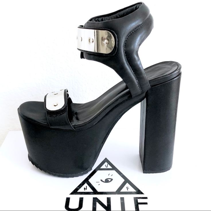 Unif The Goner Platform Heels New With Box. Retail: $250. Size: Us7. These Sky-High Platforms Come Equipped With A Manmade Leather Sole And Metal Buckles With Cushioned Velcro Closure. Leather Upper. Heel Height: 6“. Platform Height: 3“. There Are Some Minor Marks On The Sole From Trying Them On. Modern Silver Heels With Buckle Closure, Silver Leather Heels With Sculpted Heel, Silver Stacked Heel For Night Out, Silver Closed Toe Heels With Stacked Heel, Silver Leather Heels With Buckle Closure, Silver Sandals With Sculpted Heel For Night Out, Modern Silver Heels For Night Out, Modern Ankle Strap Heels With Metal Feet, Modern Silver Sandals For Night Out