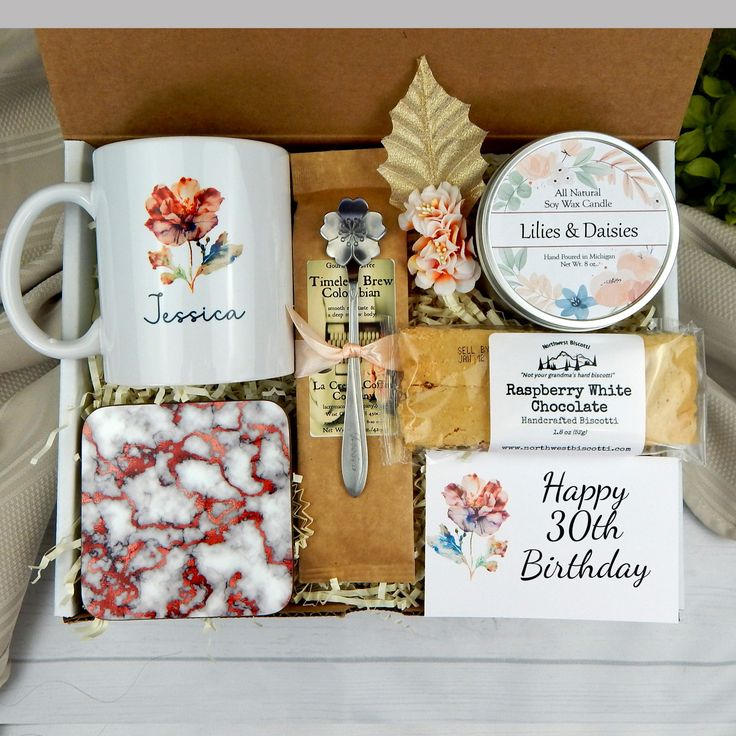 a gift box filled with coffee, cookies and other items for someone's 30th birthday