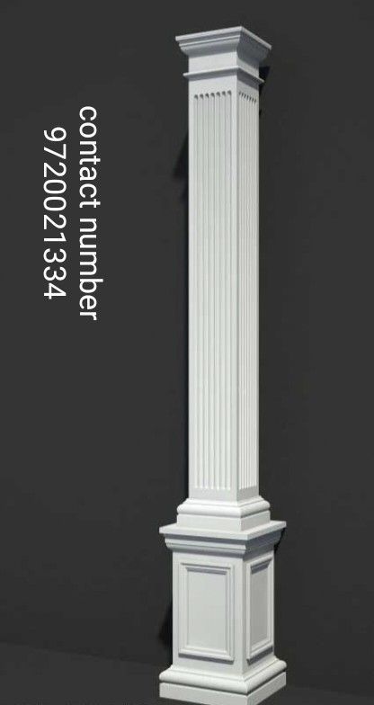 a tall white pedestal with columns on the top and bottom, in front of a black background