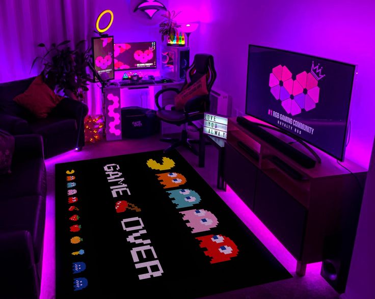 a living room filled with furniture and purple lighting on the walls, along with a large rug that says game over