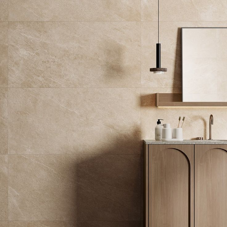 a bathroom with a sink, cabinet and mirror