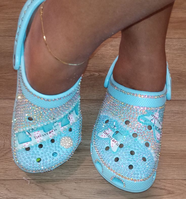 Crocs come in various colors, choose your color and the color of your rhinestones or pearls and allow me to bring your vision to life! Patches and designs can be added. Crocs Custom, Designer Crocs, Bling Crocs, Cross Shoes, Human Body Activities, Crocs Ideas, Custom Sneakers Diy, Custom Crocs, Custom Bling