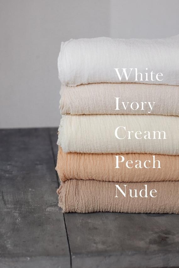 four different types of blankets stacked on top of each other with the words white ivory cream peach nude