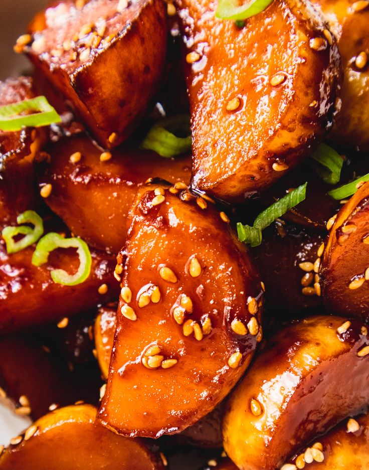 some food is sitting on a plate with sesame seeds