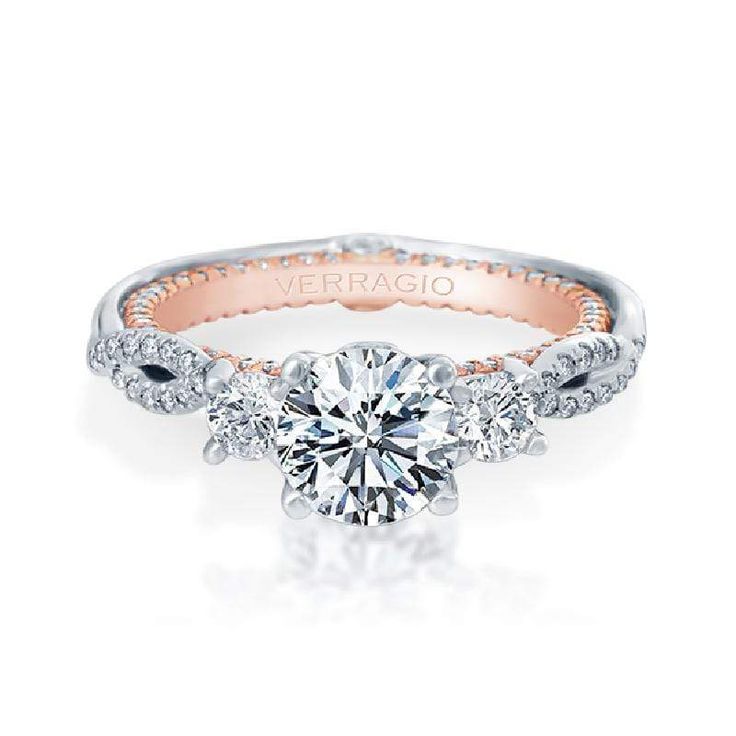 a diamond engagement ring with three stones on the side and an inscription that reads, verragio