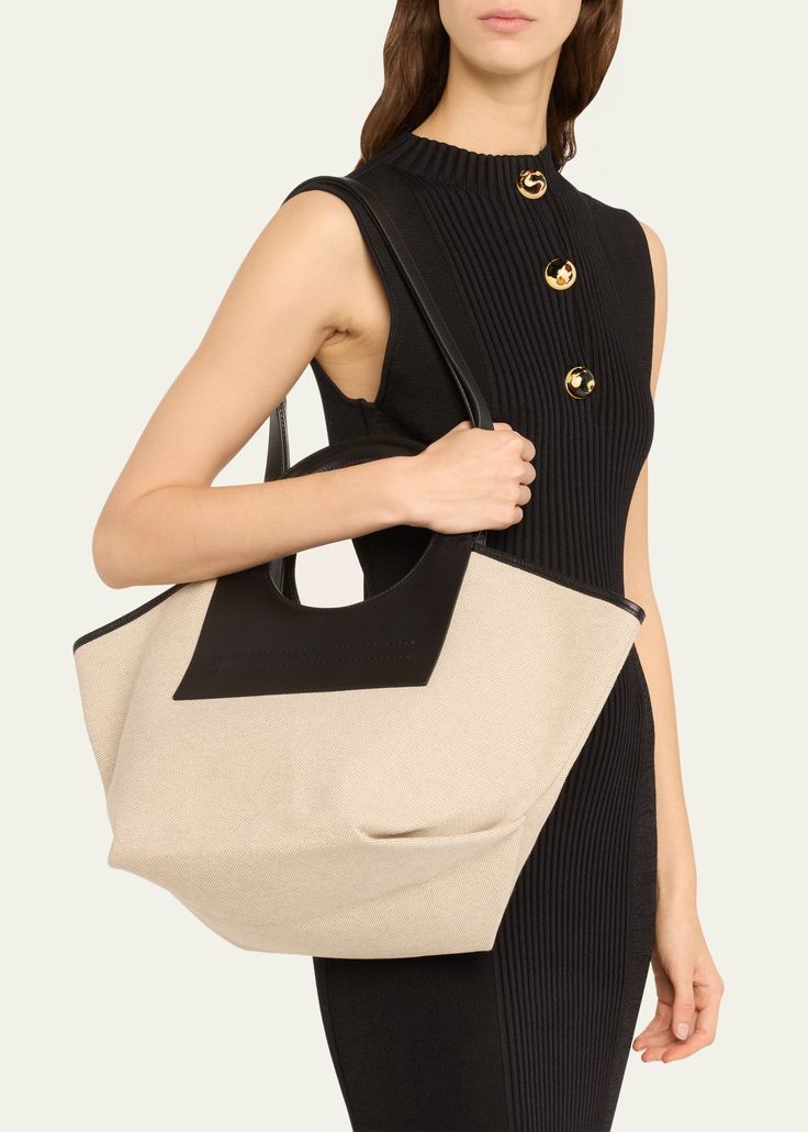 "Find HEREU Cala Small Canvas Tote Bag on Editorialist. HEREU \"Cala\" tote bag in canvas and calf leather Ring cutout top handles Shoulder strap, 32.7\" drop Open top with selftie closure Cotton lining Approx. 11.8\"H x 21.3\"W x 9.1\"D Wipe clean Made in Spain" Elegant Tote Canvas Bag For On-the-go, Chic Canvas Bags With Rolled Handles, Chic Canvas Bag With Rolled Handles, Designer Canvas Bag With Detachable Handle, Chic Canvas Bag With Handle Drop For Shopping, Luxury Canvas Evening Bags, Luxury Evening Canvas Bags, Elegant Canvas Tote Bag With Detachable Handle, Elegant Canvas Tote With Detachable Handle