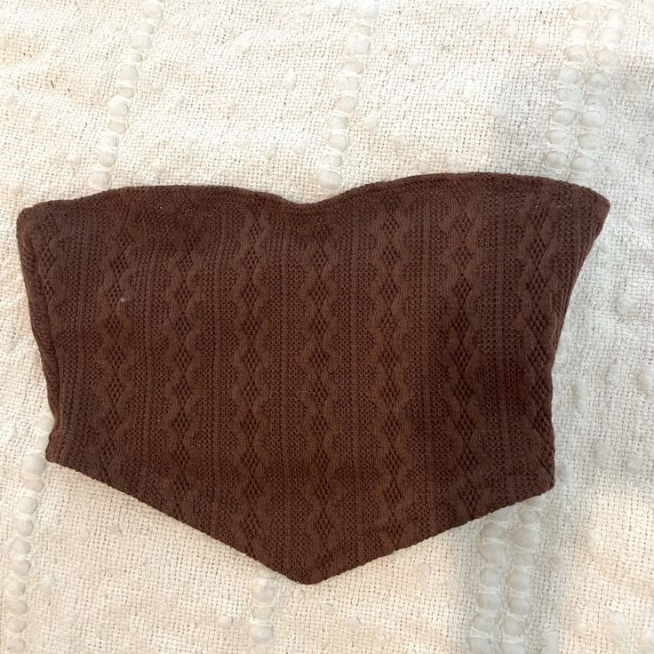 Never Worn, Perfect Condition. Size Xs Brown Fitted Knit Crop Top, Fitted Brown Knit Crop Top, Brown Fitted Strapless Top, Fitted Knit Strapless Tube Top, Fitted Seamless Knit Tube Top, Fitted Strapless Knit Tube Top, Fitted Strapless Brown Top, Brown Stretch Tube Top For Spring, Spring Brown Stretch Tube Top