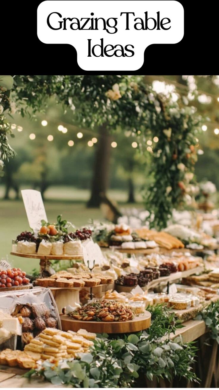 A beautifully arranged grazing table featuring colorful fruits, cheeses, and snacks for a wedding reception or party. Buffet Table Food Display, How To Keep Grazing Table Cold, Bbq Table Decorations Backyard Parties, White Grazing Table, Diy Grazing Table Wedding, Wedding Taco Bar Setup Ideas, Birthday Buffet Table Ideas, Wedding Food Set Up, Grazing Tables Ideas