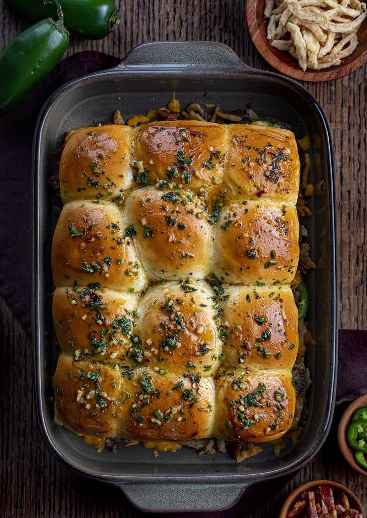 a casserole dish filled with bread and vegetables