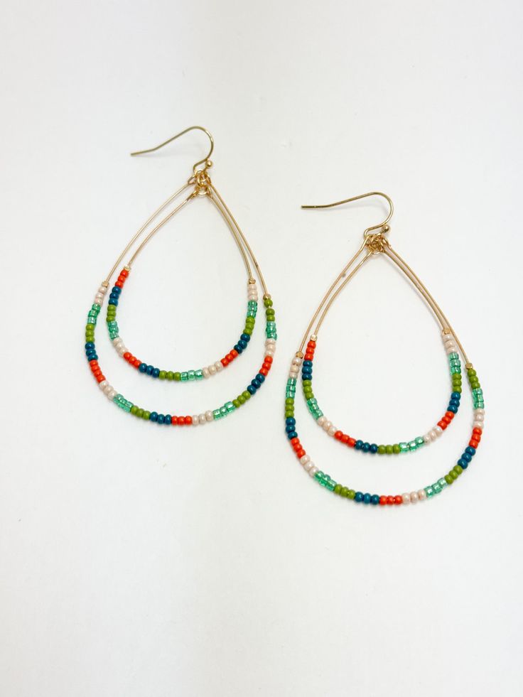 Teal & Orange Beaded Teardrop Earrings Turquoise Teardrop Earrings With Faceted Beads, Green Beaded Dangle Teardrop Earrings, Beaded Teardrop Earrings For Summer, Summer Beaded Teardrop Earrings, Turquoise Teardrop Earrings With Tiny Beads, Summer Teardrop Beaded Earrings, Summer Dangling Bead Teardrop Earrings, Summer Teardrop Earrings With Dangling Beads, Bohemian Orange Teardrop Jewelry