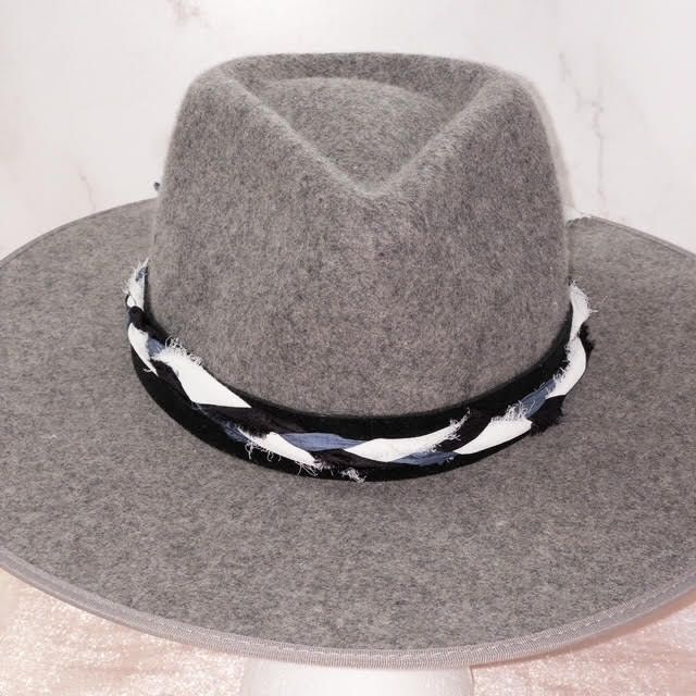 Ready to add a little twist to your brim? The band is 22.5" x 1.5" and has adjustable ties in the back so it can fit hats from 22.5-34". The bottom layer is soft black suede that will look good on all hats. The top layer has is silk ribbons that have been braided to complement the leather and really bring the colors to life. The blue, white, silver and black will compliment your hat. As with all of our custom-made pieces each piece is unique and little different each time made. Please let us kno Adjustable Brimmed Felt Hat For Country Events, Country Style Hat With Adjustable Curved Brim, Country Style Adjustable Hat With Curved Brim, Adjustable Brimmed Country Felt Hat, Adjustable Brimmed Country Style Felt Hat, Adjustable Wide Brim Felt Hat For Rodeo, Adjustable Wide Brim Felt Hat For Country Events, Adjustable Hat Bands For Country Events In Fall, Adjustable Western Style Brimmed Fedora