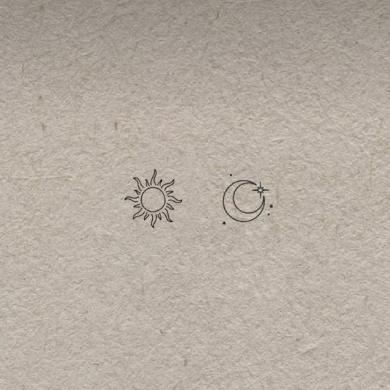 the sun, moon and stars are drawn on paper