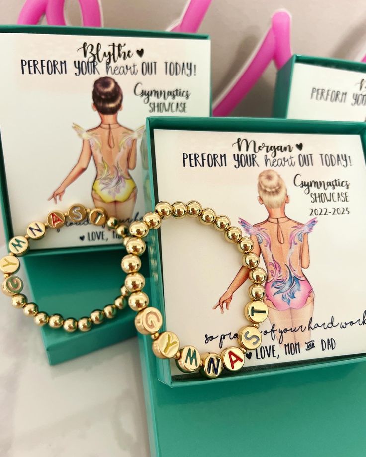 This Gymnastics beaded Bracelet & card set is the ideal gift to commemorate a special gymnastics performance. Featuring a gold beaded bracelet with the word "gymnast", the included card can be personalized with a choice of leotard color, hair, and skin tone. You can also enter your own text, making the card an unforgettable memento. With your purchase you receive: 1 "Gymnast" gold beaded bracelet (fit for young children through small adjust wrists) 1 Personalized card with text and custom Gymnas Personalized Gold Beaded Bracelet For Birthday, Flexible Hypoallergenic Stretch Bracelet As A Gift, Flexible Hypoallergenic Beaded Bracelets For Gifts, Custom Name Gold Stretch Bracelet For Gift, Flexible Personalized Bracelets As Gifts, Personalized Flexible Bracelets As Gifts, Custom Name Gold Stretch Bracelet As Gift, Adjustable Gold Stretch Bracelet For Birthday, Customized Gold Stretch Bracelet As Personalized Gift