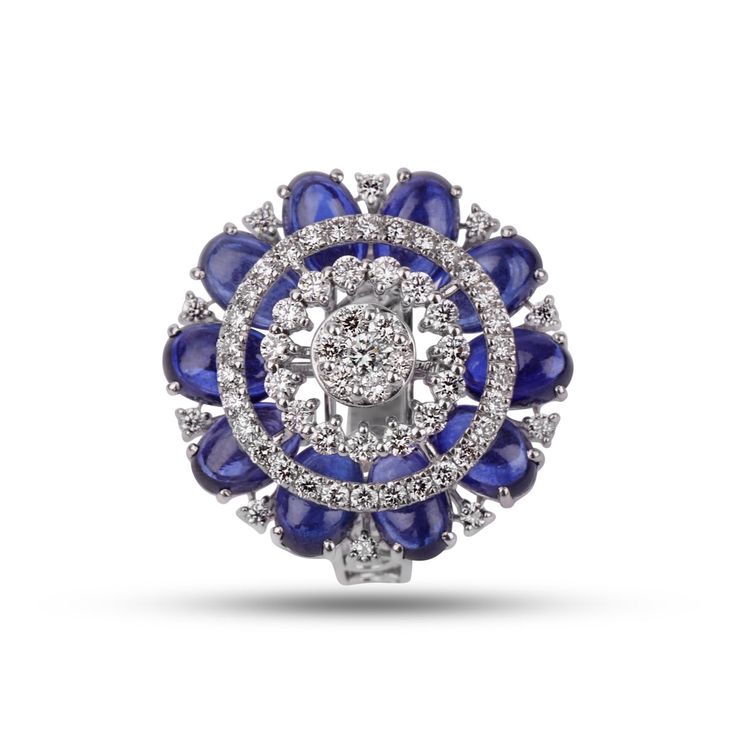 Like the stars dazzling in a clear winter night sky, the diamonds set against the backdrop of brilliant sapphires of the Blue Medisa ring bring a feeling of calm and serenity. Fit for regality, you can wear this gorgeous piece of art when you want all the attention to yourself. Luxury Cluster Diamond Ring With Gemstone, Fine Jewelry Sapphire Diamond Accented Ring, Dazzling Sapphire Ring With Diamond, Luxury Diamond Cluster Ring With Gemstones, Luxury Sapphire Diamond Ring With Center Stone, Luxury Sapphire Gemstone Cluster Ring, Luxury Sapphire Ring With Brilliant Cut Cubic Zirconia, Luxury Sapphire Cluster Ring With Gemstones, Luxury Sapphire Diamond Ring With Gemstone