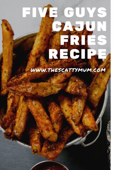 the five guys'cajun fries recipe is in a metal bowl with dipping sauce