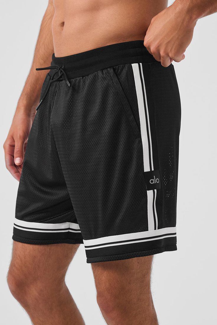 Basketball shorts are always a good idea—especially when they’re this functional and fresh. This pair is designed with a drawstring waist, a relaxed fit, zippered side pockets, and cool contrasting trim. The unlined design is extra versatile, so you can pick the right base layer for every activity, but it’s the drapey, stretchy, seriously breathable fabric that scores bonus points on- and off-the-court. Casual Moisture-wicking Bottoms By Alo Yoga, Casual Alo Yoga Short Bottoms, Alo Yoga Moisture-wicking Casual Bottoms, Alo Yoga Casual Shorts, Casual Shorts With Contrast Trim, Sporty Alo Yoga Bottoms, Casual Alo Yoga Gym Bottoms, Casual Alo Yoga Shorts, Casual Alo Yoga Bottoms For Gym