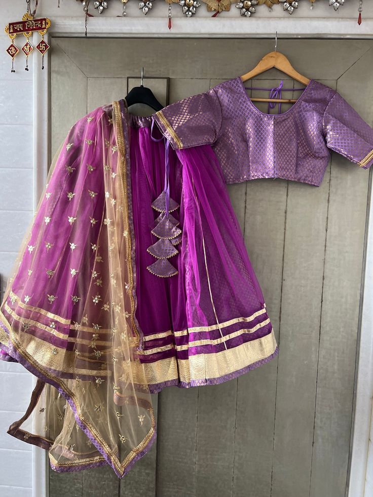 Custom made beautifull costume with double layers skirt of brocade and net The combo includes  - 8 meter flare lehenga - custom made blouse - 2.5 meters dupatta/scarf - belt  connect with us before placing the order +91 7737288355 to discuss measurements  It comes with golden tassels, dupatta of your choice and blouse  Discuss with our designers about your dancing dress +91 7737288355  Negotiation on price as per quantity.  Bollywood dance costume- Kalbelia dance costume- Indian dance - Pakistani dance - wedding costume - dance - ghoomar - Tera tali dance Gold Anarkali Choli For Traditional Ceremonies, Fitted Anarkali Net Choli, Festive Fitted Lehenga In Net Material, Festive Fitted Lehenga In Net, Bollywood Style Lehenga For Traditional Ceremonies, Traditional Drape Bollywood Lehenga For Ceremonies, Traditional Fitted Net Choli, Bollywood Style Gold Lehenga For Traditional Ceremonies, Fitted Net Sharara For Navratri