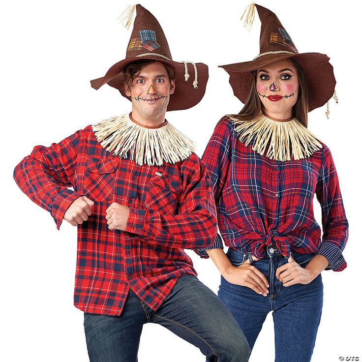 two people dressed in scarecrow costumes posing for the camera