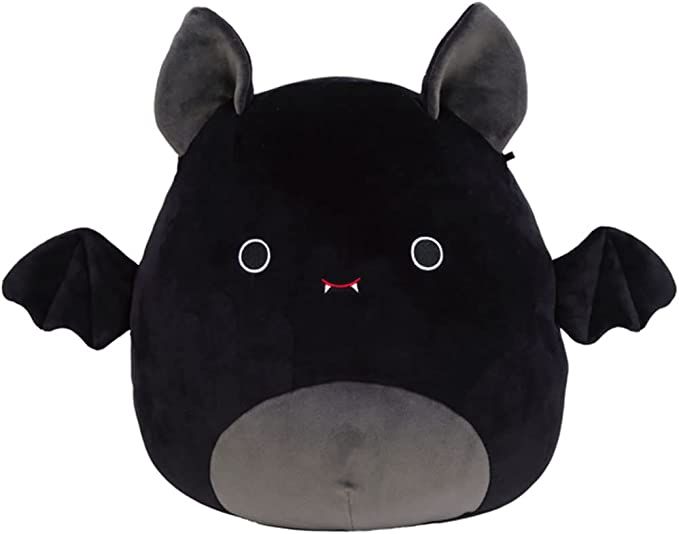 a black stuffed animal with large ears and eyes