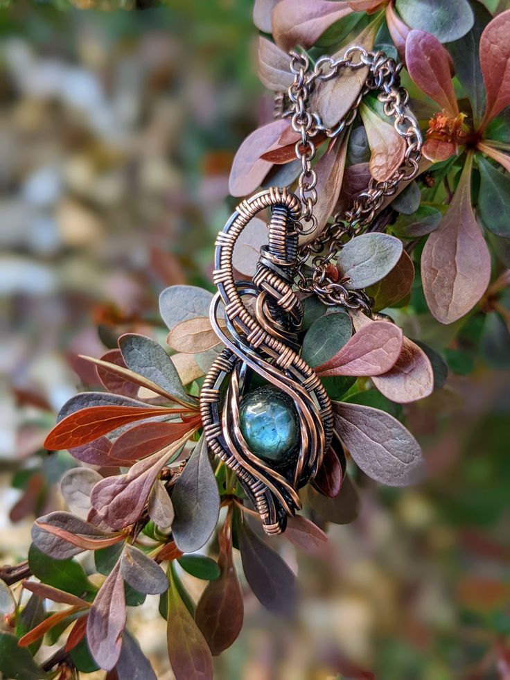 Just recently I got supplies and was able to play with oxidizing necklaces. This is one of the first four I oxidized, and I love how it turned out. The necklace has so much depth and detail. It looks like it has a story to it. It turned out so pretty and I am so excited to make more. This necklace is a labradorite stone wrapped in copper wire and oxidized. The chain is oxidized as well. Unique Oxidized Finish Necklace For Gift, Unique Oxidized Necklace For Gift, Hand Wrapped Metal Pendant Necklaces, Hand Wrapped Metal Pendant Necklace, Bohemian Hand Forged Necklace As Gift, Artistic Oxidized Necklace For Gift, Labradorite Necklace For Gifts, Artisan Hand Wrapped Metal Necklace, Artistic Pendant Jewelry