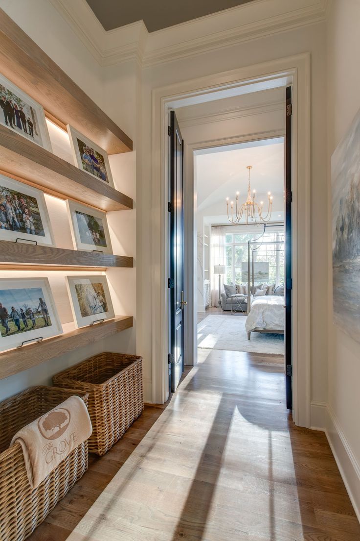 the hallway is clean and ready for guests to use it as an entrance way in this home