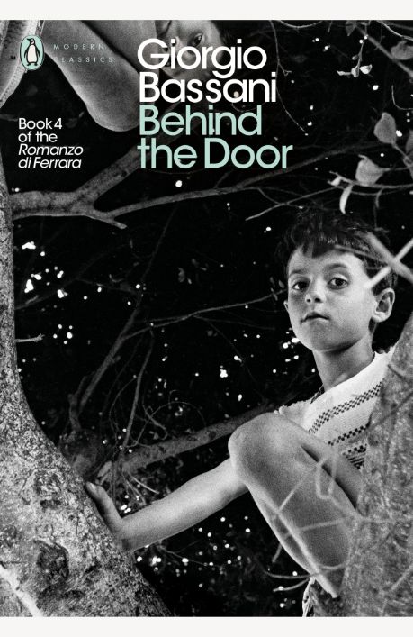 a young boy standing on top of a tree next to a leaf filled forest with the words, gorgo bassani behind the door