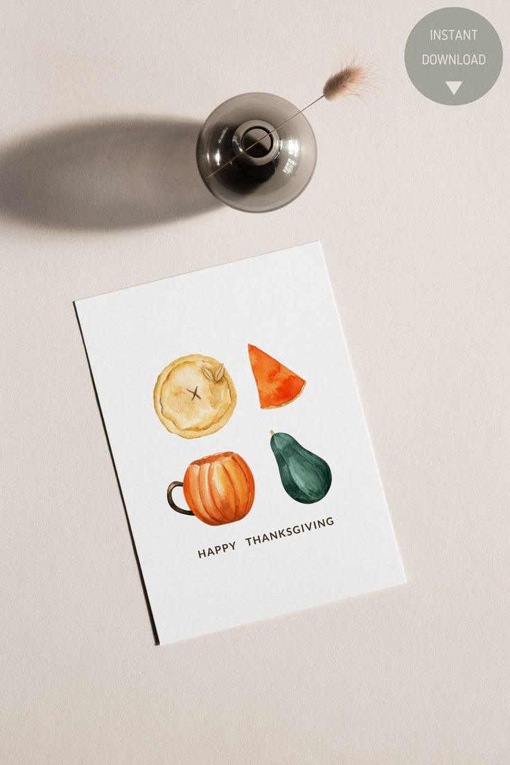 a thanksgiving card with watercolor pumpkins and pears on it, next to a coffee cup