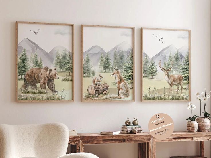 three framed pictures hang on the wall above a chair and table in a living room