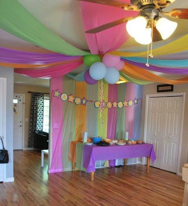 a party room decorated with balloons and streamers