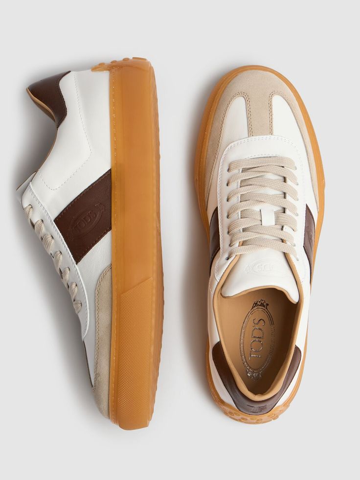 Suede and leather upper. Front lace-up closure. Logo details. Rubber sole Brown Leather Sneakers, Brown Sneakers, Latest Sneakers, Crossbody Messenger Bag, Sneakers Blue, Sneakers Grey, Low Top Sneakers, Sports Brands, Suede Sneakers