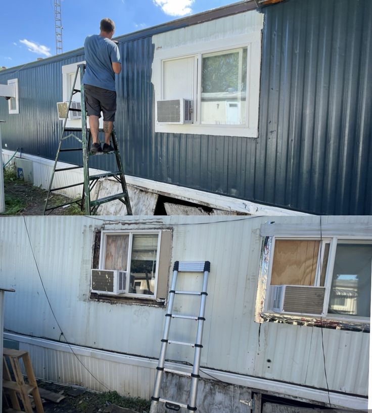 a man standing on top of a ladder next to a metal building with windows and siding