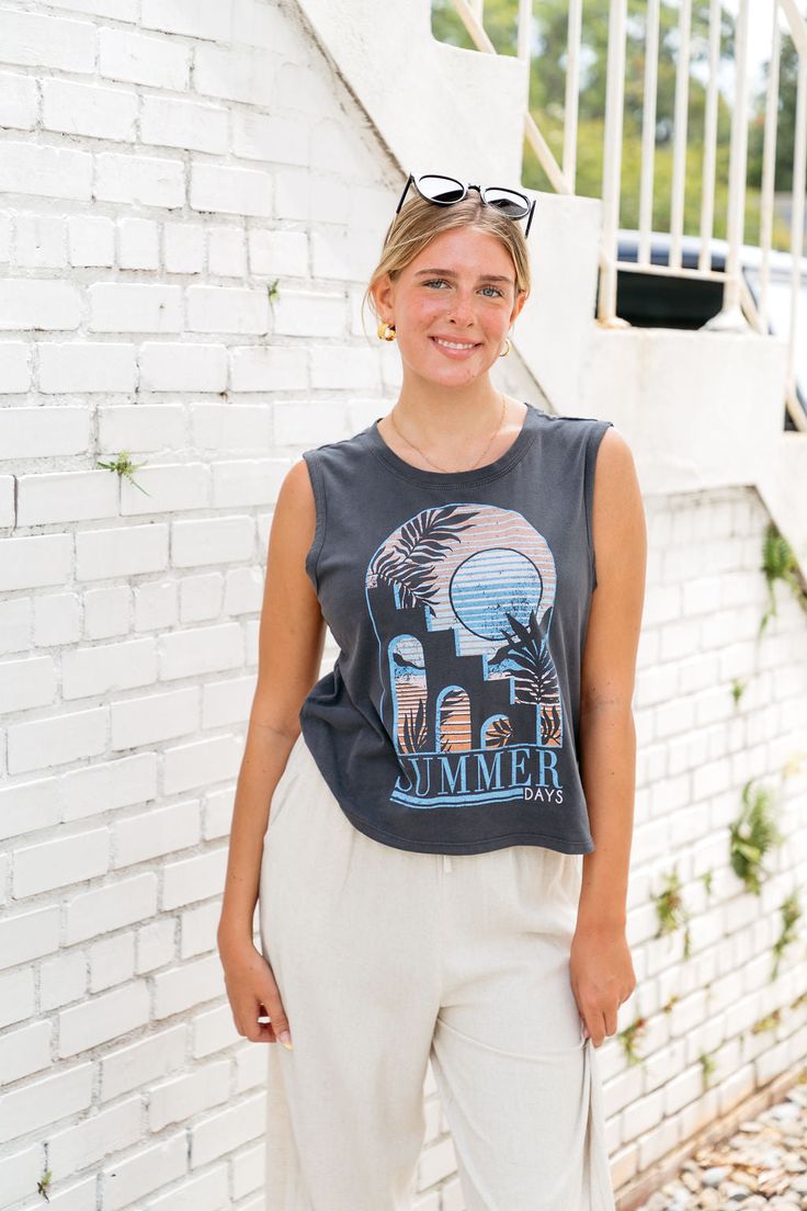 You're gonna love the all day comfort of our Summer Days Z Supply Graphic Muscle Tee. This classic cotton crew neck features a moroccan inspired summer graphic and the vintage wash gives it that lived in feel thats perfect for beach days. Pair this tank with your favorite denim shorts and a sneaker for that everyday summer look. muscle tank top summer graphic relaxed fit fits true to size, model wears a size small 100% cotton machine wash cold, tumble dry low Graphic Muscle Tee, Muscle Tank Top, Romper And Jacket, Muscle Tank Tops, Muscle Tee, Summer Tank Tops, Top Summer, Muscle Tank, Muscle Tanks