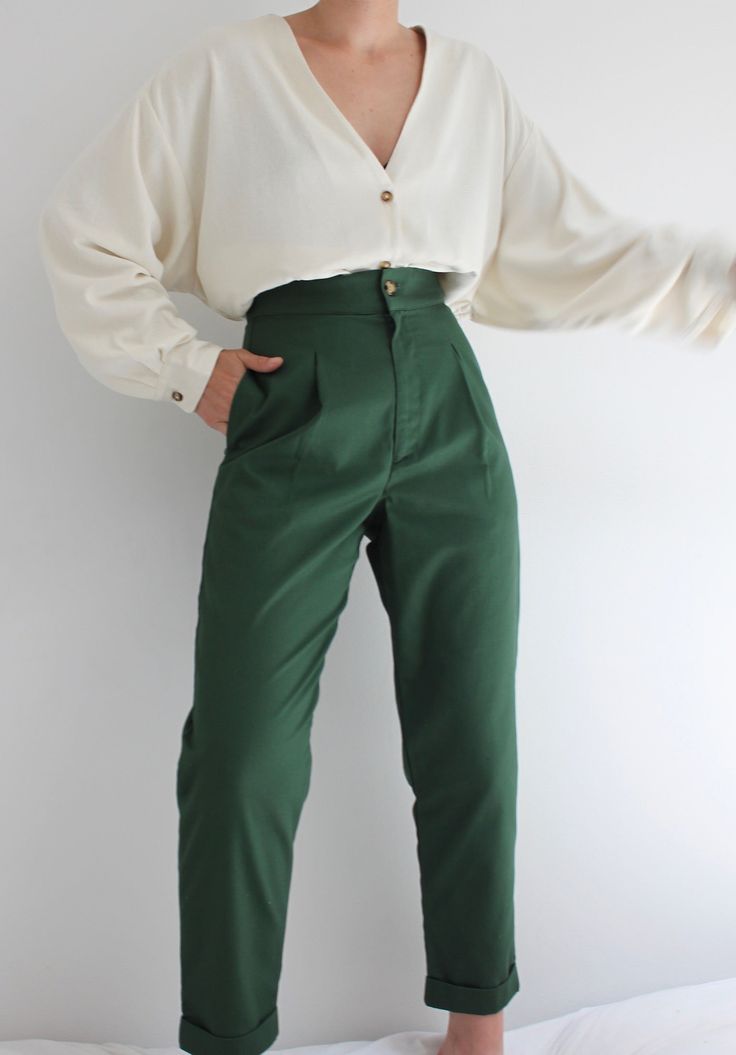 The Oliver Pant is an everyday go-to pant that features a flattering classic high waist, side seam pockets, front pleat detailing, and a cuffed straight tapered leg. This hero fabric is comparable to the feel of vintage khaki chinos; lightweight, and substantial, with that already broken-in feel. One of the first original Na Nin designs, coveted and beloved by many - we're pleased to reintroduce our Oliver Pants in beautiful french cotton twill with updated sizing and grading in this beautiful f Classic High-waisted Cargo Pants For Work, Green Relaxed Fit Pants For Workwear, Classic Cargo Pants For Fall Workwear, Classic Fall Cargo Pants For Workwear, Classic High-waisted Relaxed Fit Cargo Pants, Classic High-waisted Cargo Pants, Chic Khaki Cargo Pants For Work, Classic Green Workwear Pants, Tapered Chinos For Workwear