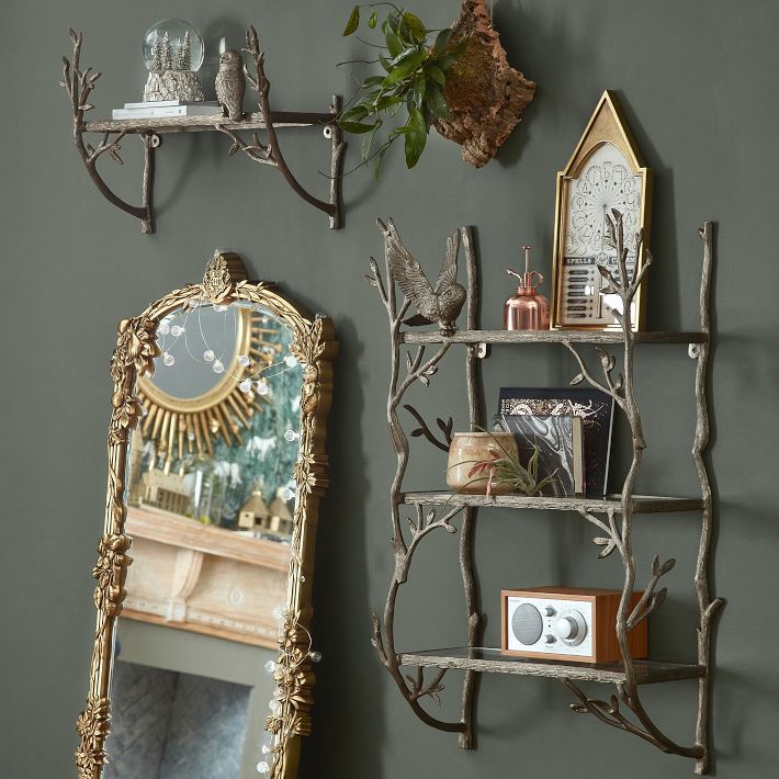 the wall is decorated with decorative items and mirrors