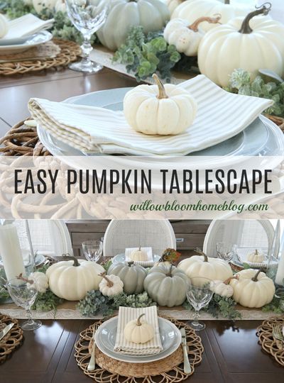 the table is set with white pumpkins and greenery on it, along with other dishes