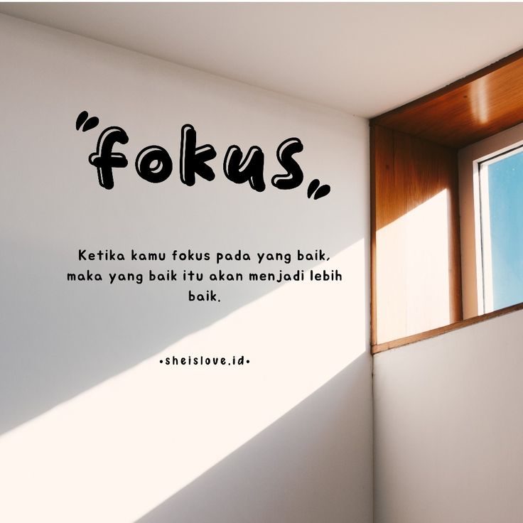 a window with the words fokus on it in front of a white wall