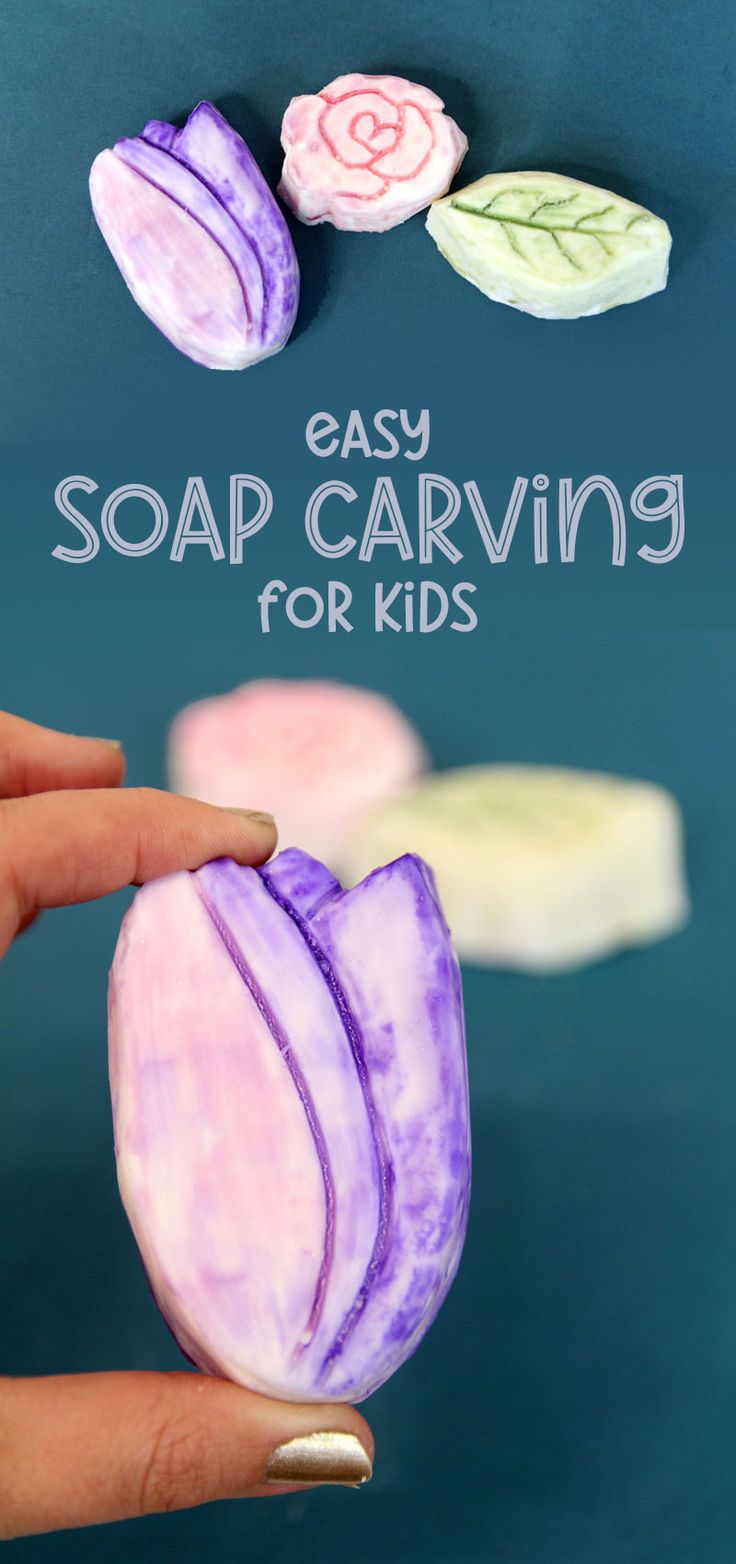 a hand holding an easy soap carving for kids with flowers and leaves on the background