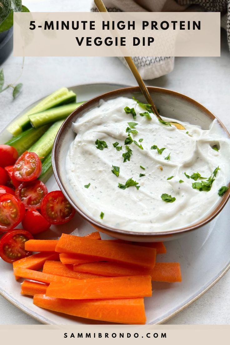 a white plate topped with vegetables and dip