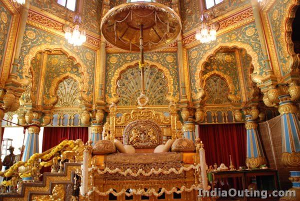 an ornately decorated room with gold and red decor