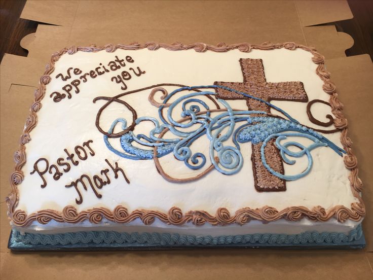 a cake decorated with the words pastor mark and a cross on it's side